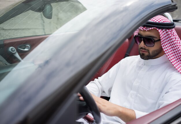 Arab man in a car driving